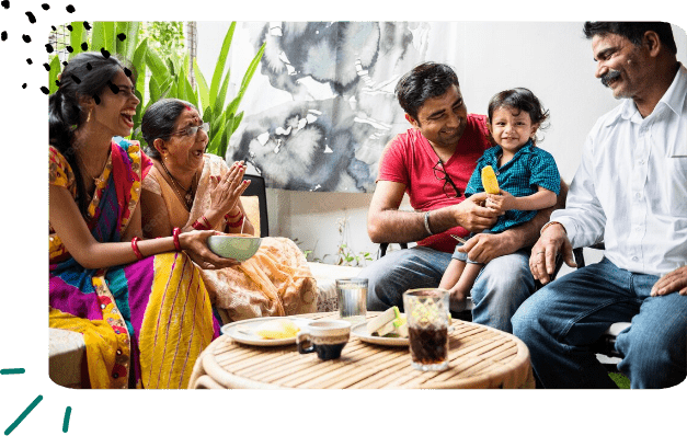A happy family sitting together and laughing, representing the positive impact of Insnap's commitment to housing equity investments